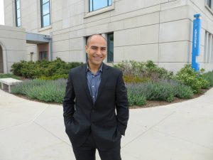 Ninos with a new suit at Loyola University Chicago, post transformation 