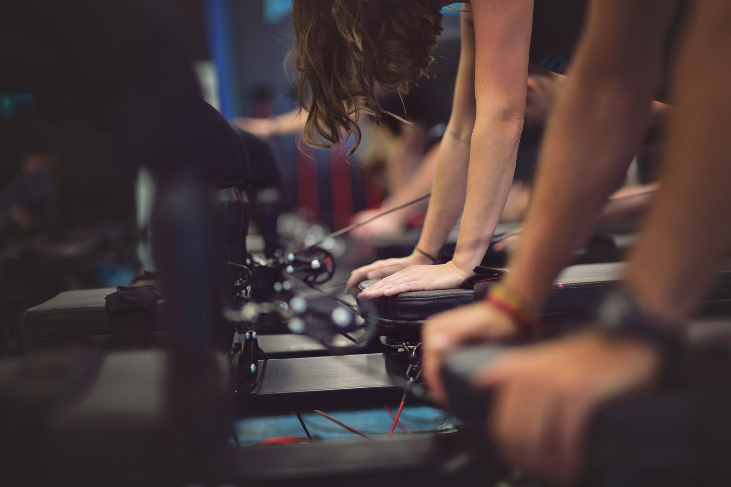 close up of students working on megaformer machines