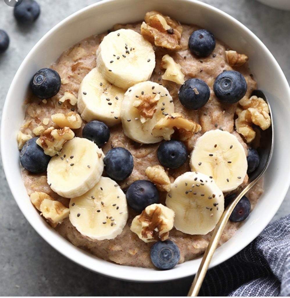 oats, bananas, and fruit in a bowl 