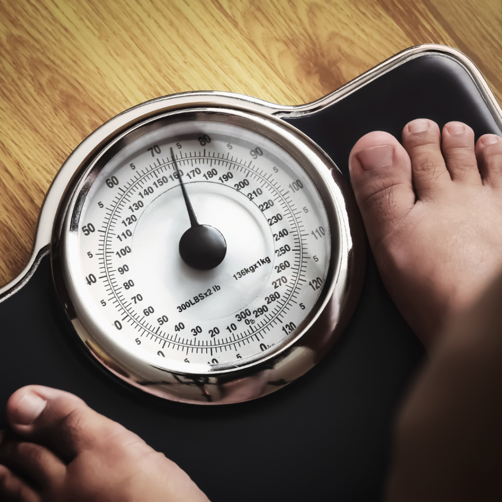 person standing on bathroom scale