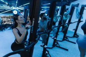 People doing full-body cardio on VersaClimbers at Studio Physique