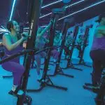 people on versaclimbers during a class